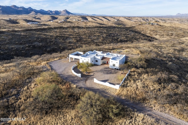 birds eye view of property with a mountain view