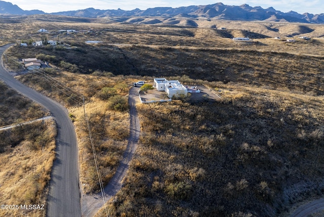 drone / aerial view featuring a mountain view