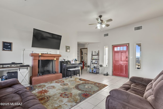 tiled living room featuring ceiling fan