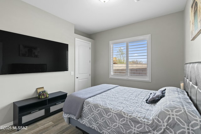 bedroom featuring hardwood / wood-style flooring