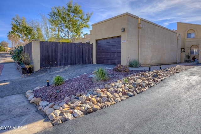 view of side of home featuring a garage