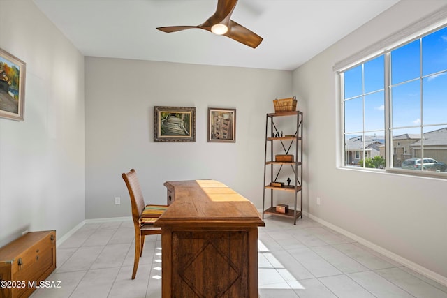 office featuring light tile patterned floors and ceiling fan