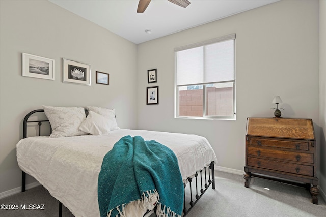 bedroom featuring ceiling fan and light carpet