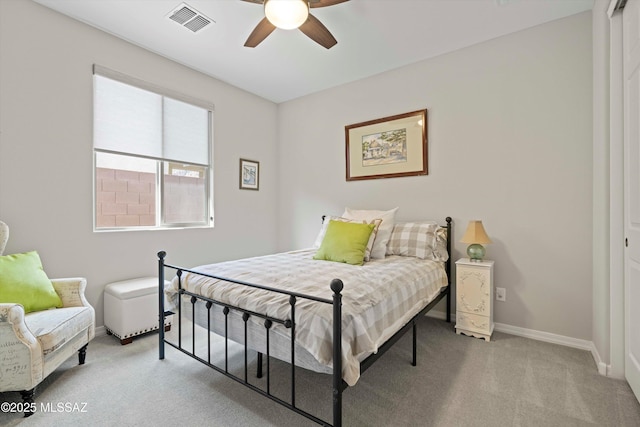 bedroom with ceiling fan and light colored carpet