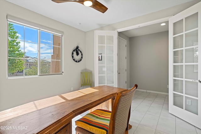 tiled office featuring ceiling fan