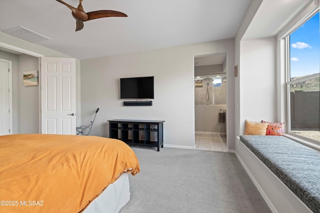 bedroom featuring ceiling fan, connected bathroom, and carpet flooring