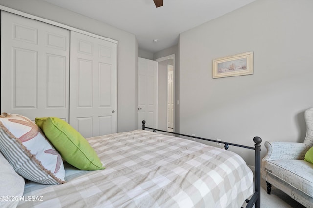 bedroom featuring ceiling fan and a closet