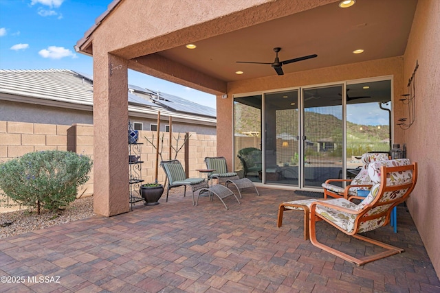 view of patio / terrace featuring ceiling fan