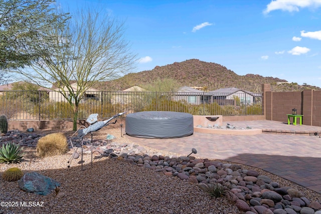 exterior space with a mountain view and a patio