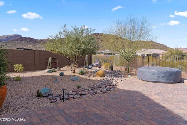 view of patio / terrace with a mountain view