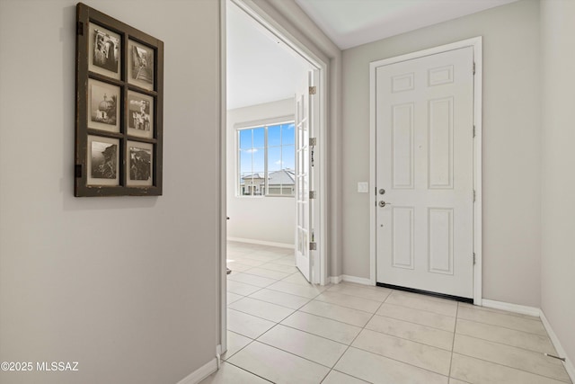 foyer entrance featuring light tile patterned floors