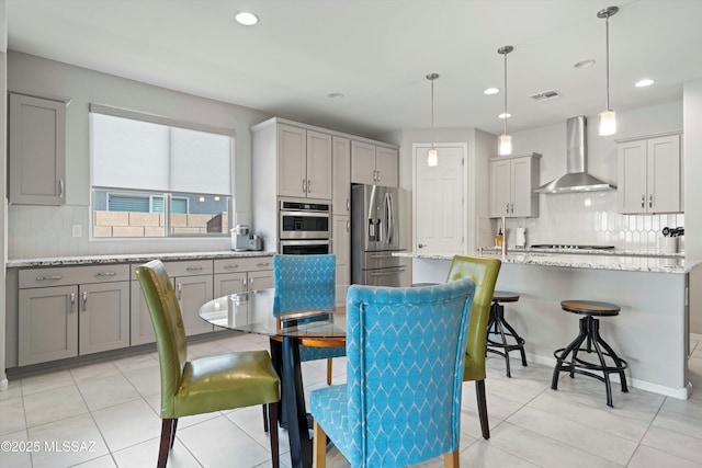 dining space featuring light tile patterned floors