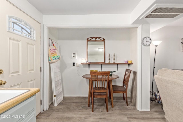 dining room featuring light wood-type flooring