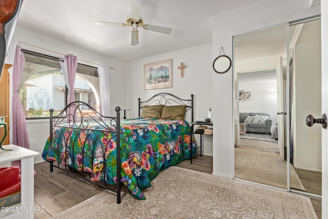 bedroom featuring light hardwood / wood-style floors and ceiling fan