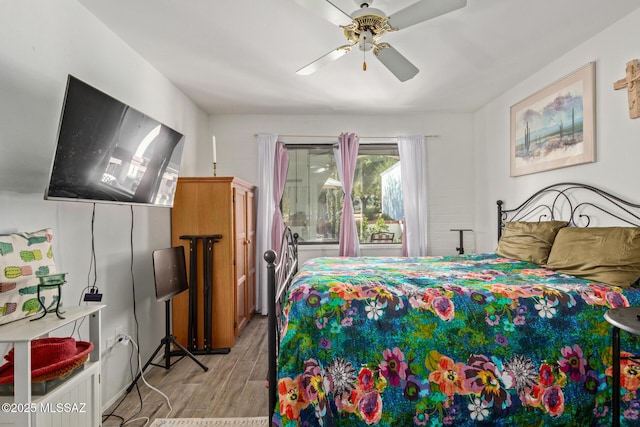 bedroom with ceiling fan and light wood-type flooring