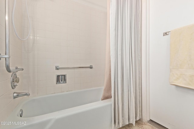 bathroom with shower / bath combo with shower curtain