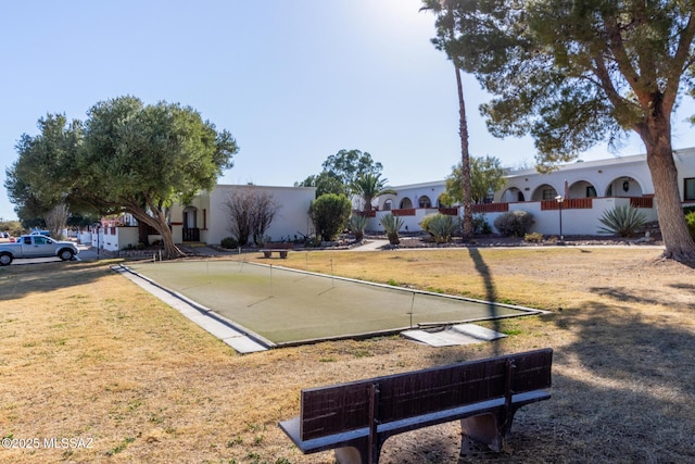 view of home's community featuring a lawn