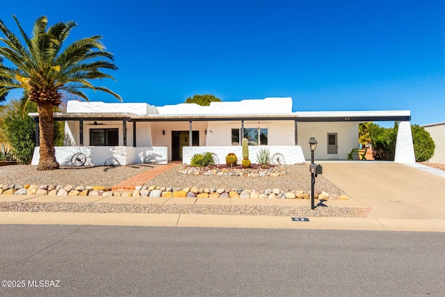 view of front of property with a carport