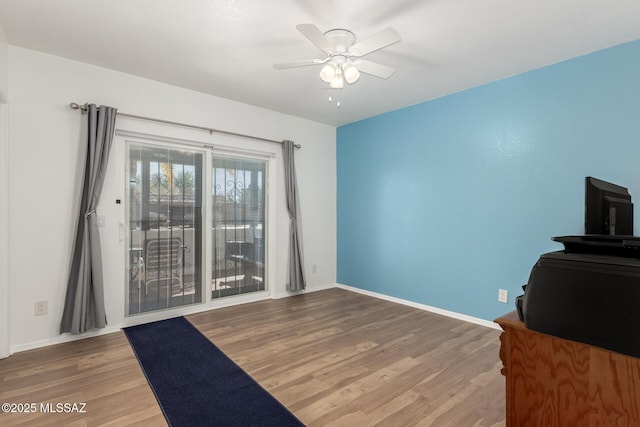 interior space featuring ceiling fan and hardwood / wood-style floors