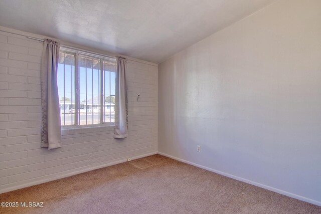 unfurnished room with light tile patterned floors and a textured ceiling