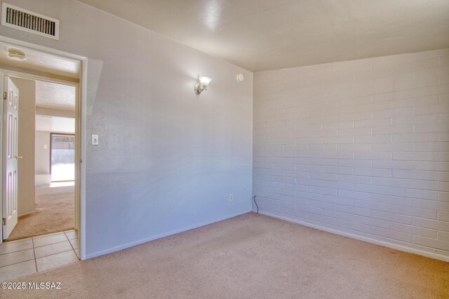 full bathroom featuring a skylight, shower / washtub combination, vanity, tile patterned floors, and toilet