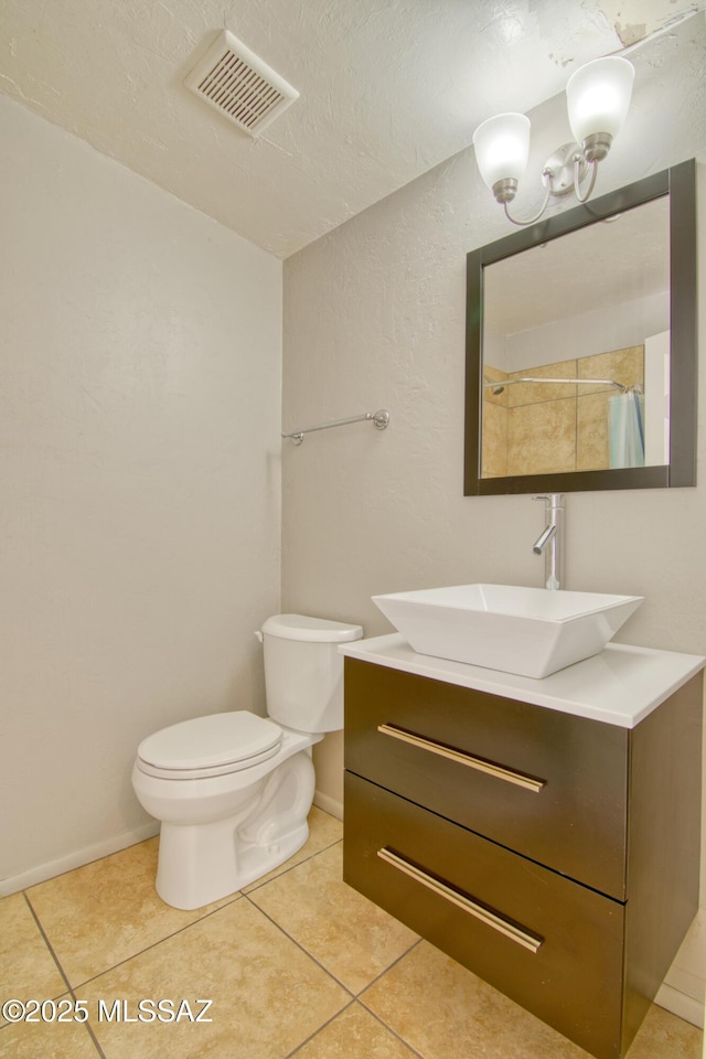 bathroom featuring walk in shower, tile patterned floors, toilet, a textured ceiling, and vanity