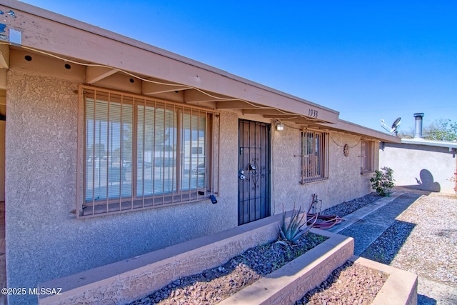 exterior space with stucco siding