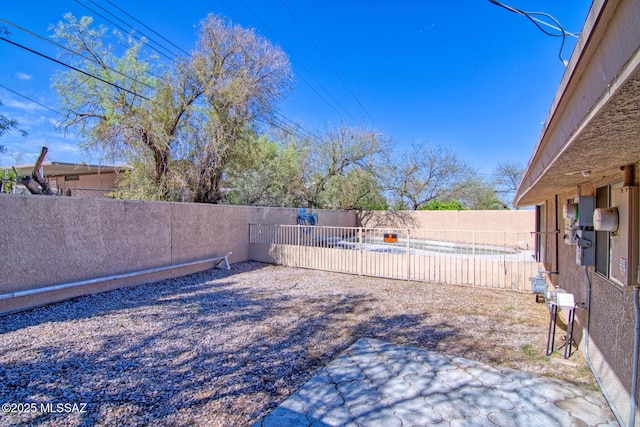 view of yard with a fenced backyard and a patio