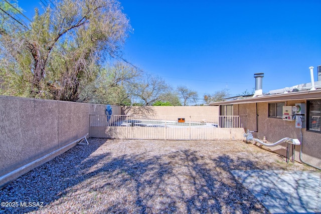 view of yard featuring a fenced backyard and a patio