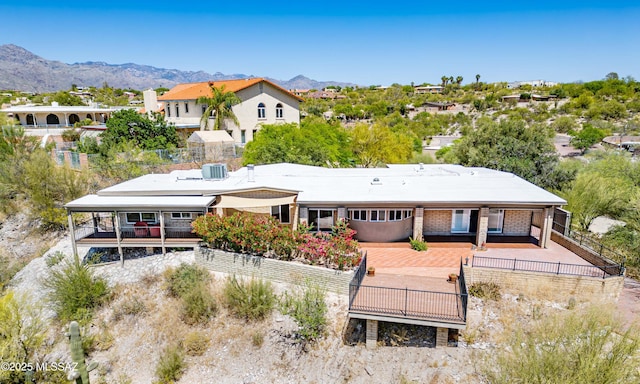 birds eye view of property with a mountain view