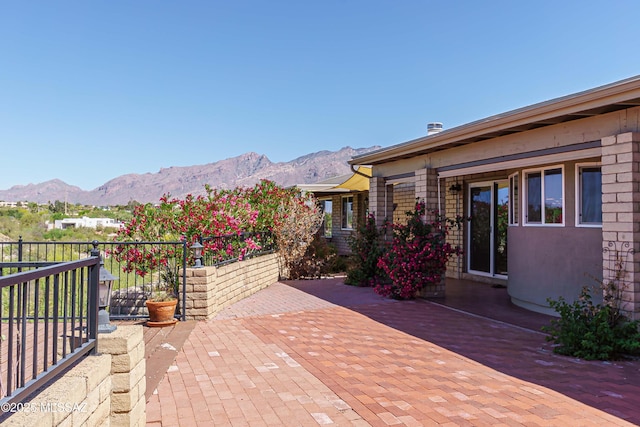 view of patio featuring a mountain view