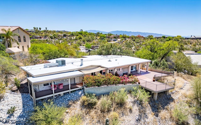 birds eye view of property with a mountain view