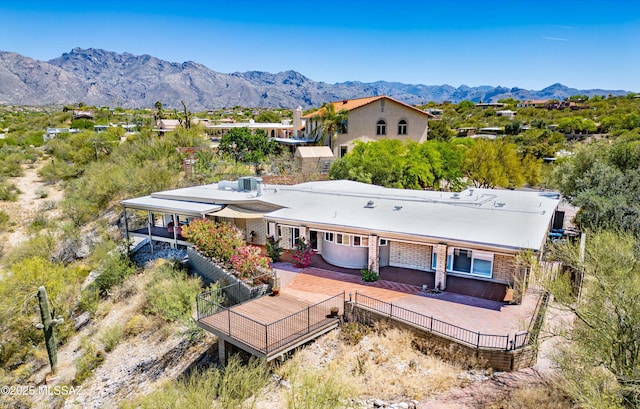 birds eye view of property with a mountain view