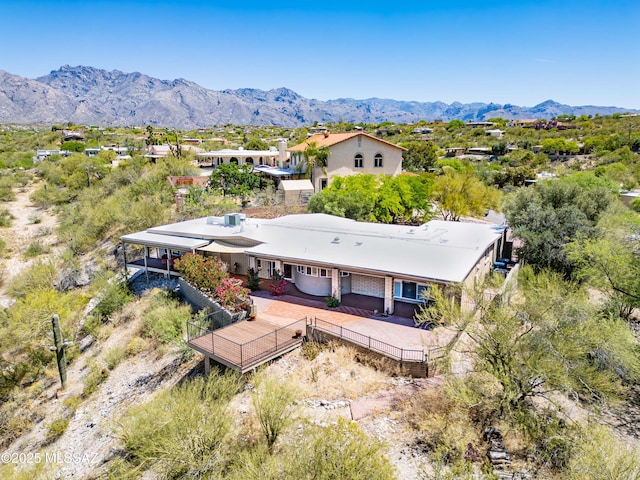 birds eye view of property featuring a mountain view