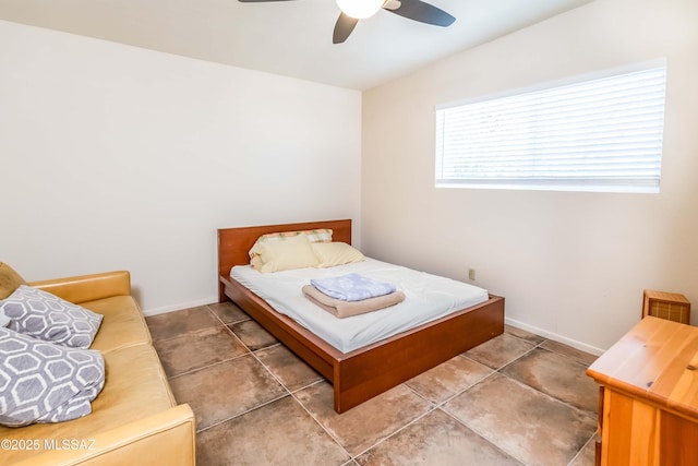 bedroom featuring ceiling fan and tile patterned floors