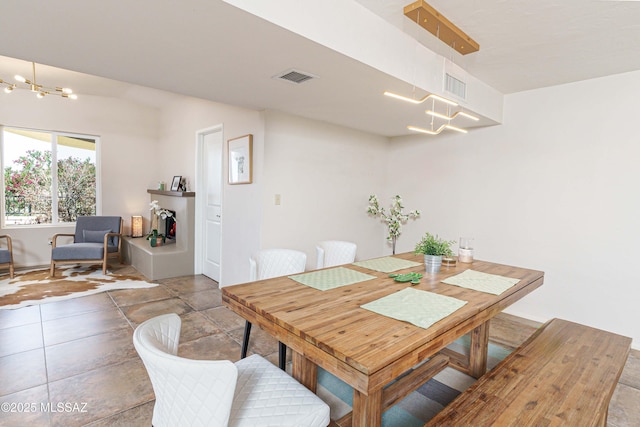 dining space featuring a notable chandelier