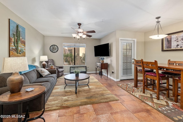 living room featuring ceiling fan