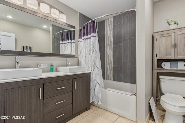 full bathroom featuring tile patterned flooring, vanity, shower / bath combination with curtain, and toilet