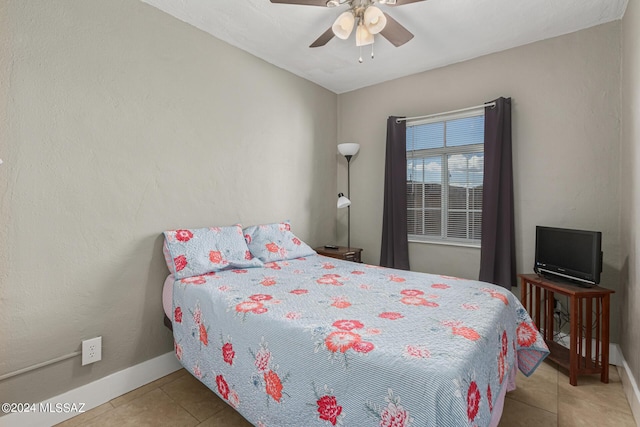 tiled bedroom with ceiling fan