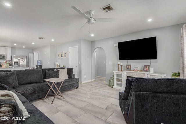 living room featuring ceiling fan