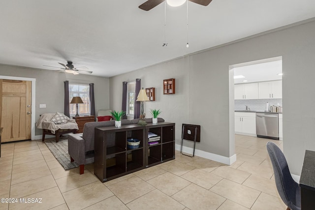 tiled living room featuring sink and ceiling fan