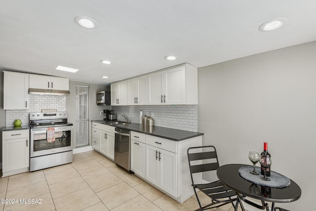 kitchen featuring white cabinetry, appliances with stainless steel finishes, and sink