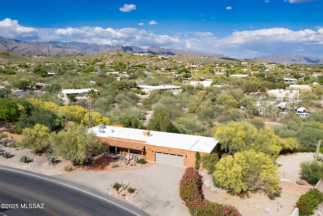 birds eye view of property with a mountain view