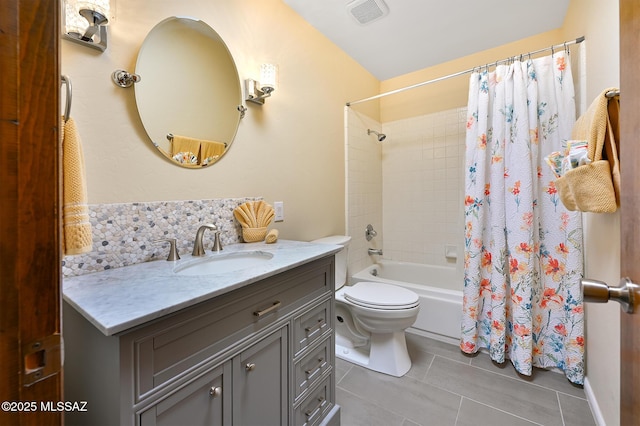 full bathroom with shower / bath combo, vanity, decorative backsplash, tile patterned floors, and toilet