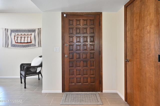 entrance foyer with light tile patterned floors