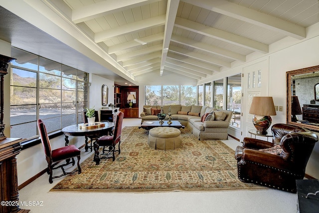 carpeted living room with vaulted ceiling with beams