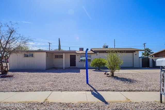 single story home featuring a garage