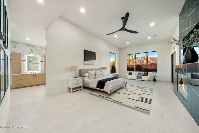 bedroom with ceiling fan and ensuite bathroom