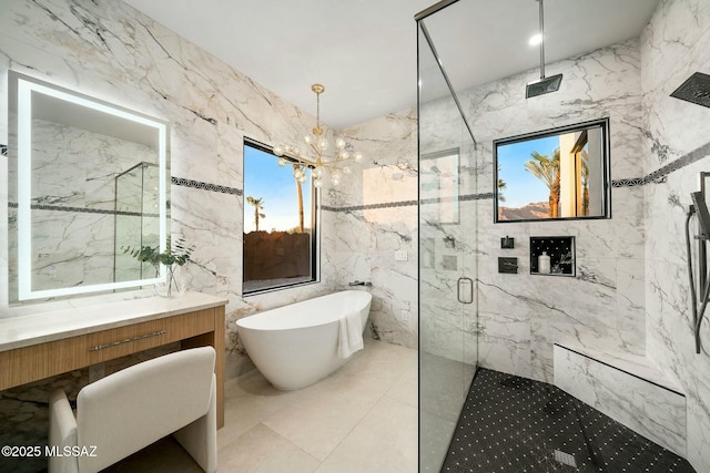 bathroom featuring vanity, separate shower and tub, tile walls, and an inviting chandelier