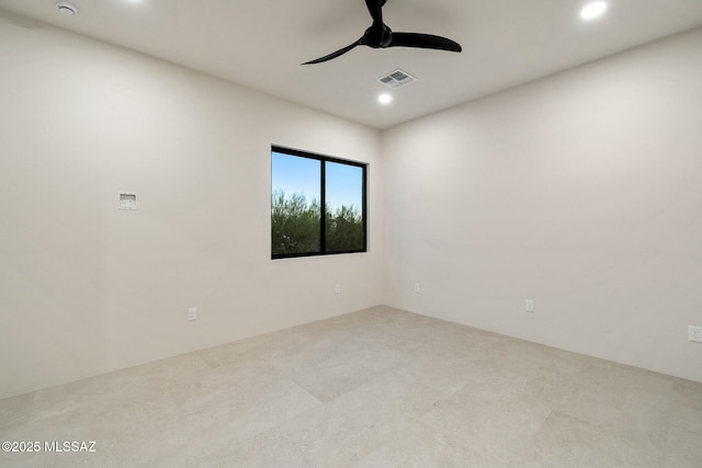 spare room with ceiling fan